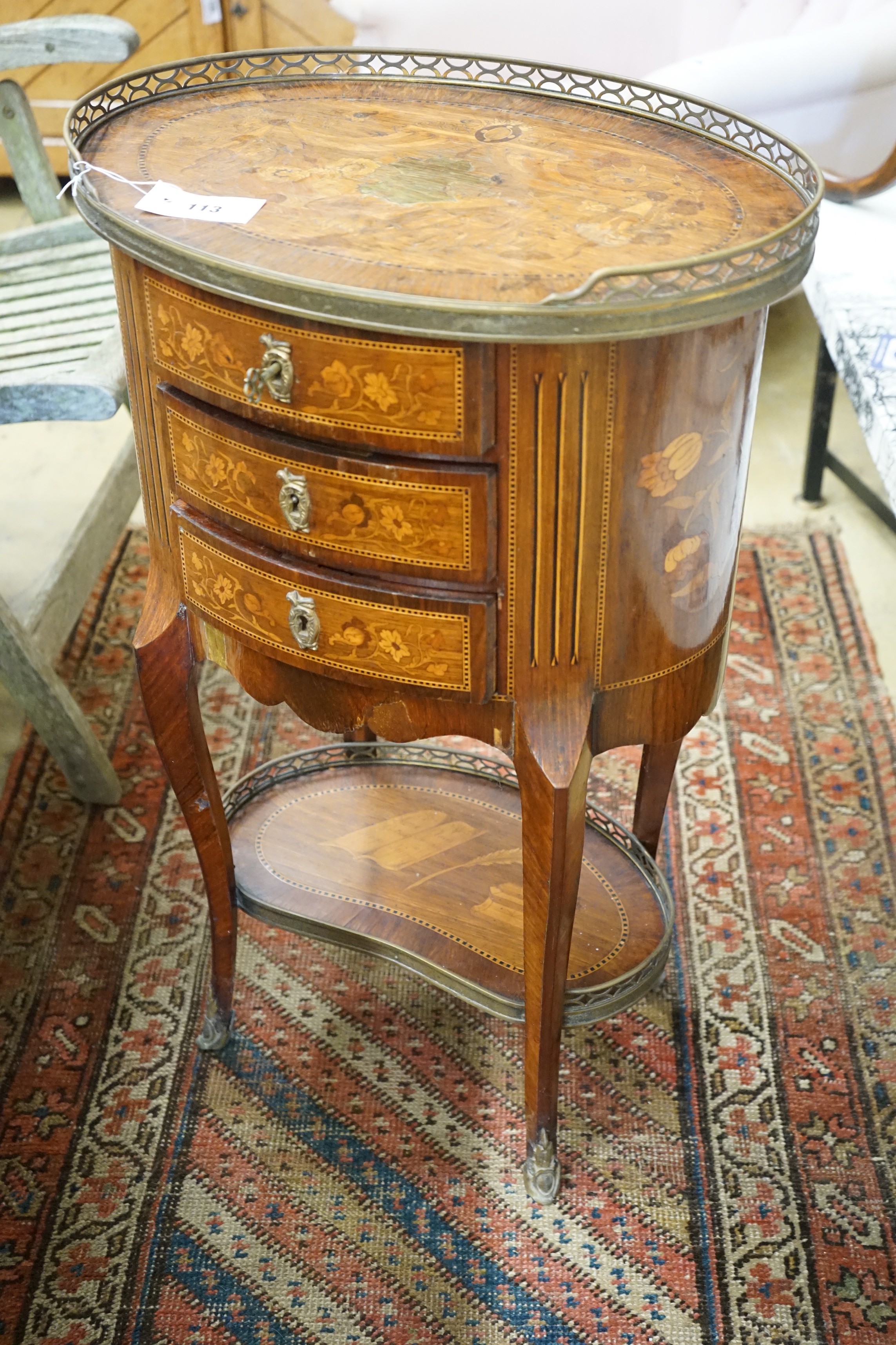 An early 20th century French marquetry oval three drawer small chest, width 50cm, depth 36cm, height 80cm